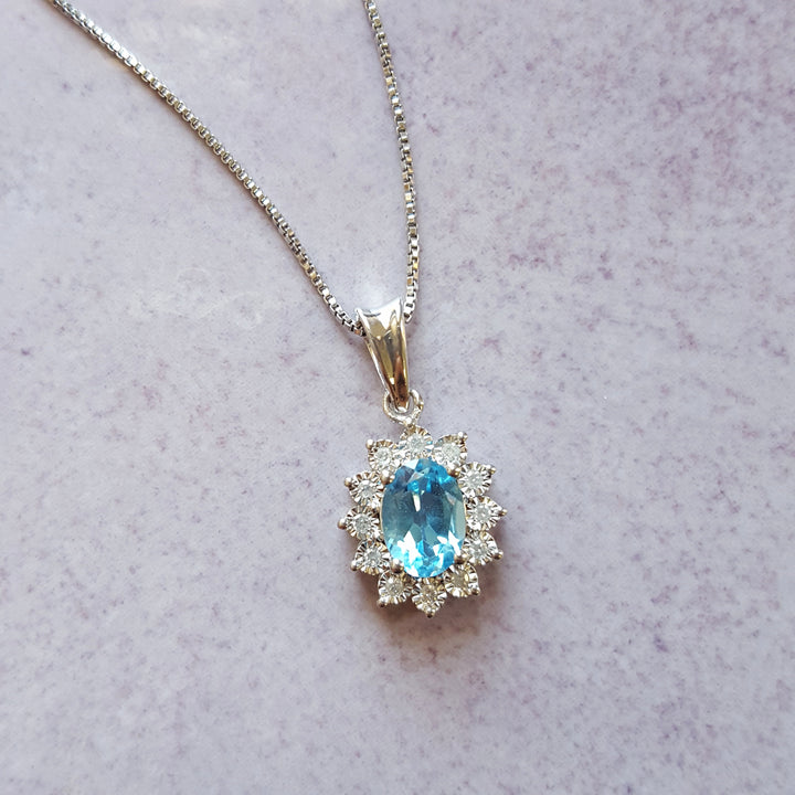 Sterling Silver Halo Blue Topaz Pendant