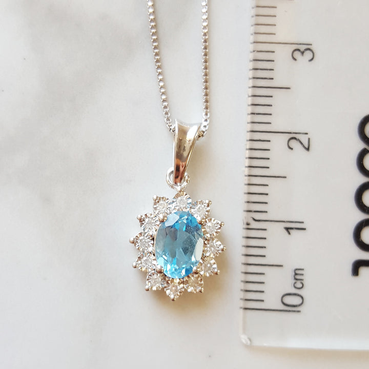 Sterling Silver Halo Blue Topaz Pendant