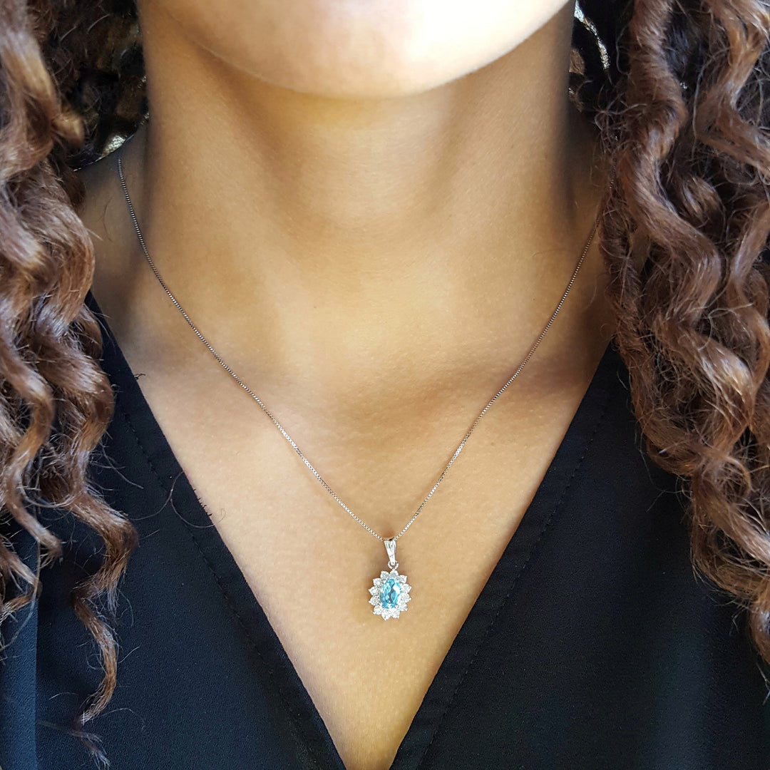 Sterling Silver Halo Blue Topaz Pendant