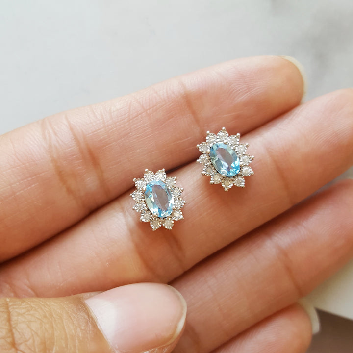 Sterling Silver Blue Topaz Halo Stud Earrings