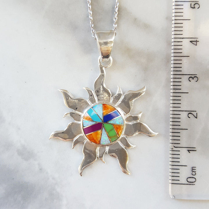 Arizona Turquoise and Inlaid Jewelry Multicolored Sun Pendant