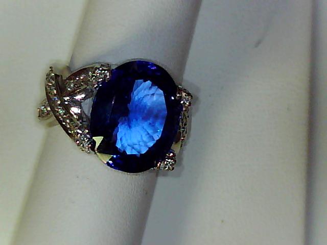 Precious Metal Gemstone Rings Over $5000