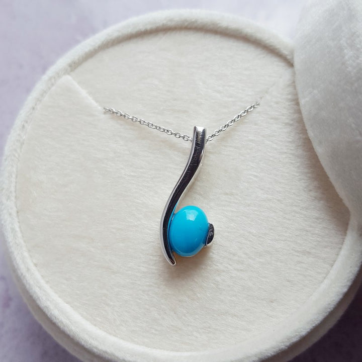 Arizona Turquoise and Inlaid Jewelry Oval Turquoise Swoop Pendant