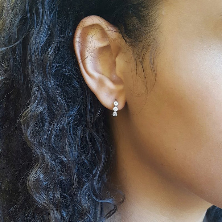 Gems One Diamond Triple Halo Cluster Earrings In 10K White Gold (1/8 Ctw)