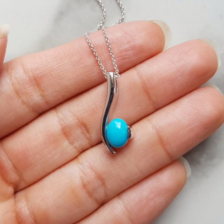 Arizona Turquoise and Inlaid Jewelry Oval Turquoise Swoop Pendant
