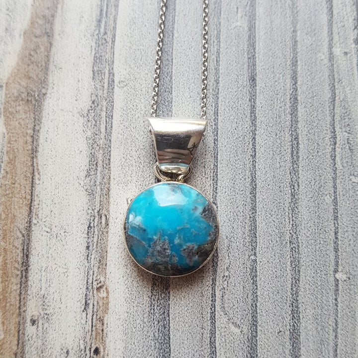 Arizona Turquoise and Inlaid Jewelry Round Arizona Turquoise Pendant