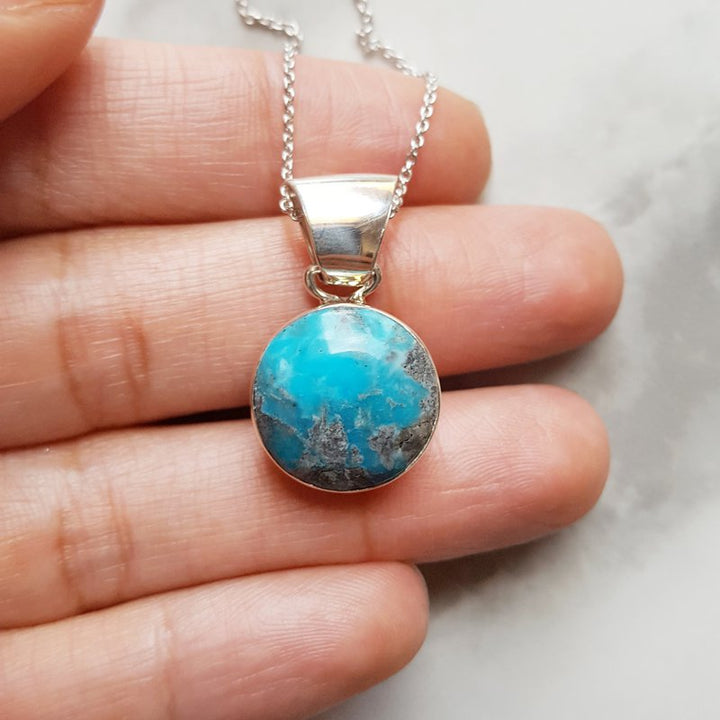 Arizona Turquoise and Inlaid Jewelry Round Arizona Turquoise Pendant