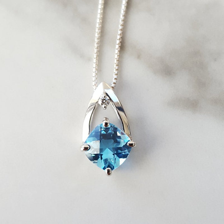 Sami Fine Jewelry Open Blue Topaz Pendant
